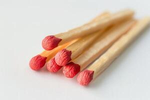 Artisanal Wooden Matchsticks Isolated on White Background photo