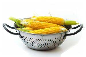 Harvested Corn on Colander for Washing Isolated on White Background photo