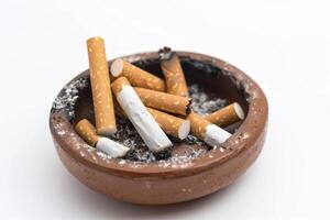 Traditional Ashtray with Cigarettes Isolated on White Background photo