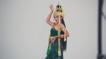 Woman performing traditional Balinese dance in costume. video