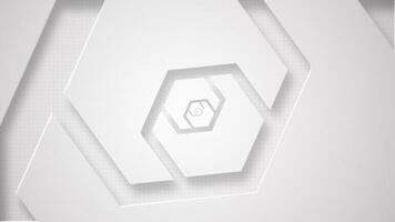 Elegant clean white abstract technology background with gently rotating extruded hexagon shapes. This stylish minimalist geometric background is full HD and a seamless loop. video