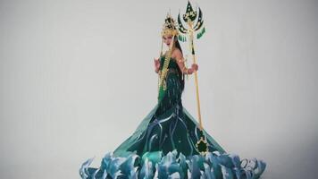 Elegant figurine of a fantasy queen with a scepter on a white background. video