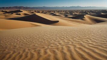 Tranquility in the peaceful desert where the vast expanse of golden sands stretches endlessly beneath a clear blue sky photo