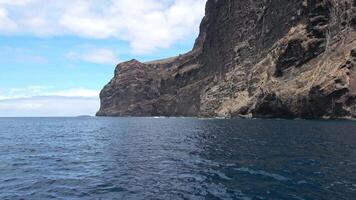 View the impressive rock formations of Les Gigantes from the ocean on Tenerife . video