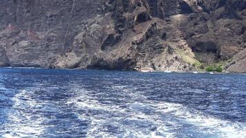 View the impressive rock formations of Les Gigantes from the ocean on Tenerife . video