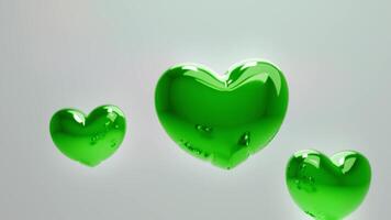 Tres verde corazones flotante en el aire video