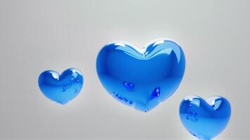 Tres azul corazones flotante en el aire video