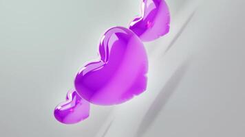 Tres púrpura corazones en un blanco antecedentes video