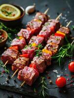 Raw beef skewers with fresh vegetables and herbs, prepared for grilling photo