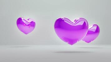 Tres púrpura corazones flotante en el aire video