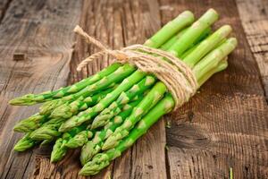 Vegetables. Green asparagus on the table. photo