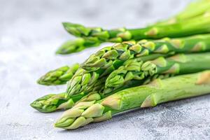 Vegetables. Green asparagus on the table. photo