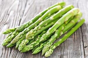 Vegetables. Green asparagus on the table. photo