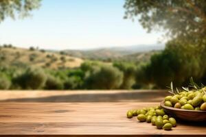 Old wooden table for product display with natural green olive field and green olives photo