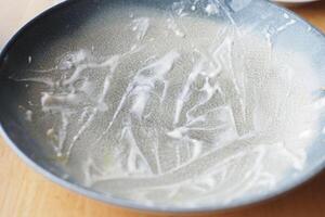 An empty dirty plate with a fork. photo