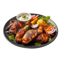 Tasty tandoori chicken plate with vegetable and lime slices on transparent background png