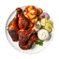 Tasty tandoori chicken plate with vegetable and lime slices on transparent background png