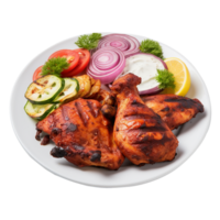 Tasty tandoori chicken plate with vegetable and lime slices on transparent background png