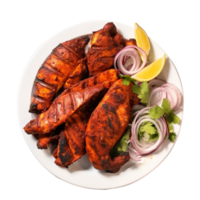 Tasty tandoori chicken plate with vegetable and lime slices on transparent background png