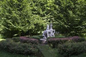 Horses statue at summer park. photo