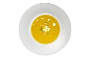 Pumpkin and carrot cream soup isolated on white background photo