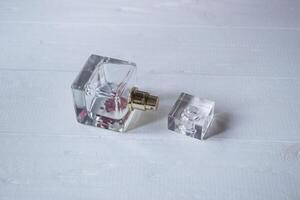 Perfume bottle on white table. photo