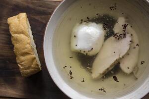 Chicken soup in a bowl on a wooden table. photo