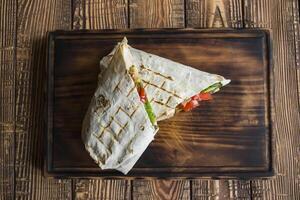 Tortilla wraps with meat and vegetables. photo