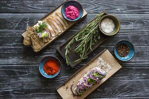 The sliced lard with bread and spices and sandwich with herring fish. photo