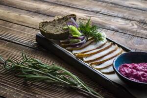 The sliced lard with bread and spices. photo