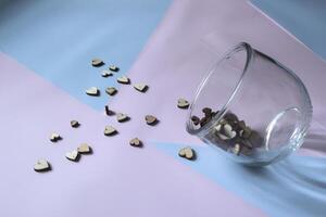 Decorative wooden hearts on a table. photo