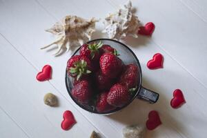 Bowl of fresh strawberries with decor. photo