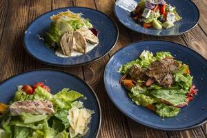 The tasty salads on a table. photo