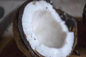 Coconut on a white wooden background. photo