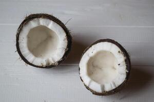 Coconut on a white wooden background. photo