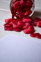 A lot of red symbols of love on the table. Love hearts. photo