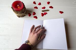Woman write in a notebook. photo