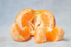 A peeled orange with the inside exposed photo