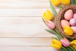 Easter holiday celebration banner greeting card banner with pink painted eggs in bird nest basket and yellow tulip flowers on white wooden background tabel texture. photo