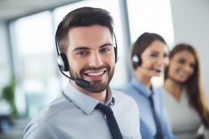 Portrait of a call center worker accompanied by his team. Smiling customer service operator at work. photo