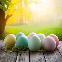 Easter eggs on wooden table against spring landscape, copy space For Social Media Post Size photo