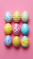 Festive Easter day candy eggs on pink background, copy space Vertical Mobile Wallpaper photo