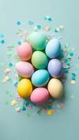 Easter concept colorful eggs, confetti, pastel background Top view Vertical Mobile Wallpaper photo