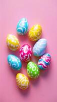 Festive Easter day candy eggs on pink background, copy space Vertical Mobile Wallpaper photo