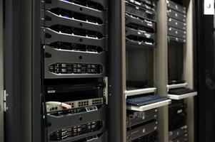 IT engineer repairing a server in a datacenter photo