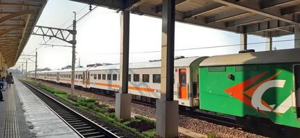 Activity people at railway train station Bekasi. Local train Indonesia. Railway road. West Java, Indonesia - April 8 2024 photo