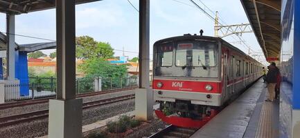 Activity people at railway train station Bekasi. Local train Indonesia. Railway road. West Java, Indonesia - April 8 2024 photo