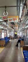 Activity people at railway train station Bekasi. Local train Indonesia. Railway road. West Java, Indonesia - April 8 2024 photo