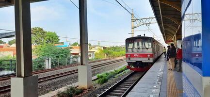 Activity people at railway train station Bekasi. Local train Indonesia. Railway road. West Java, Indonesia - April 8 2024 photo