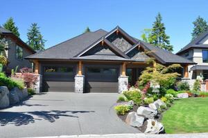 Garage door with a driveway in front. photo